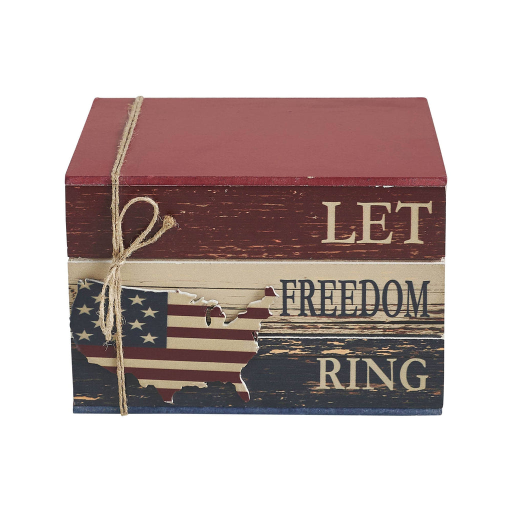 Wooden books with American flag design and 'Let Freedom Ring' text on a white background