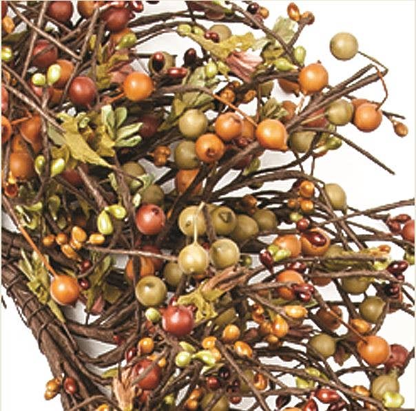 An artificial autumn  pip berry wreath with brown branches, small orange and green berries, and muted leaves, shown against a plain white background.
