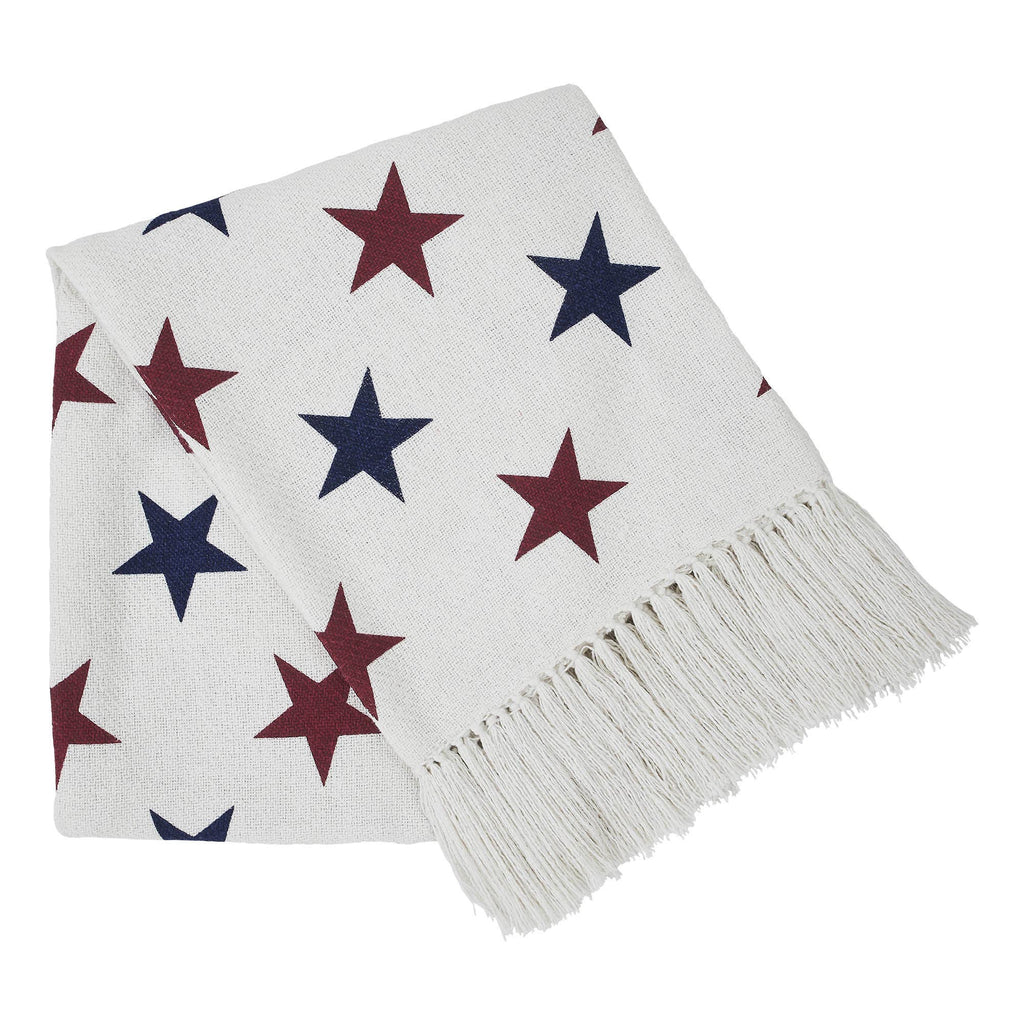 White blanket with red and blue star pattern on a white background