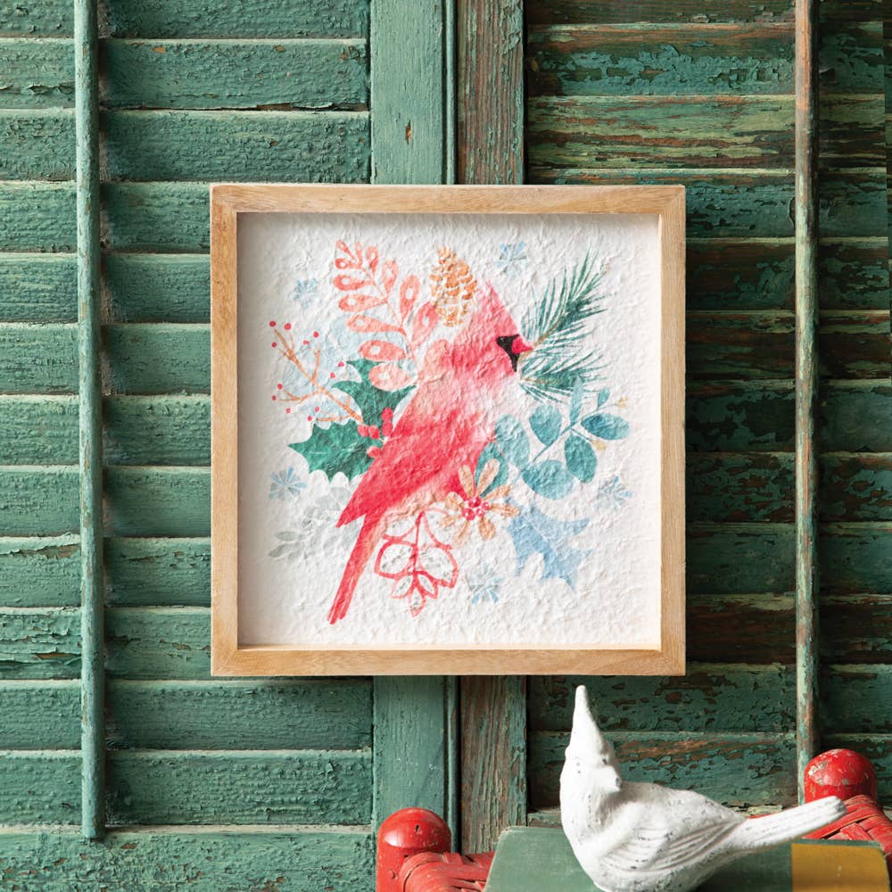 Framed artwork of a red cardinal bird with floral elements 