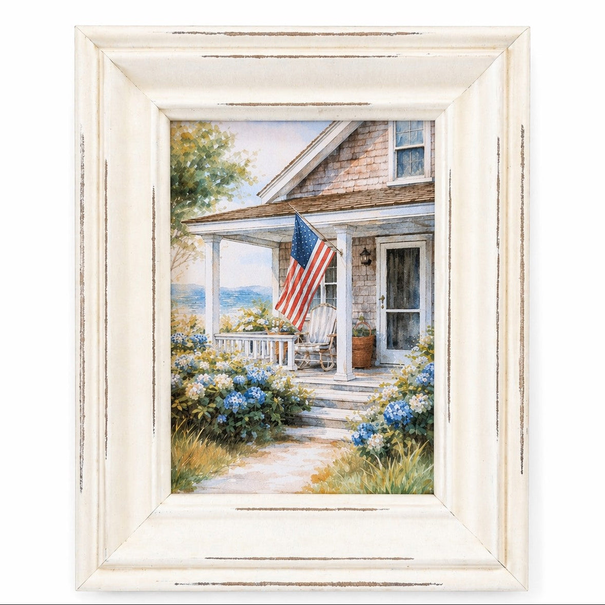 Framed artwork of a coastal house with an American flag on a white background