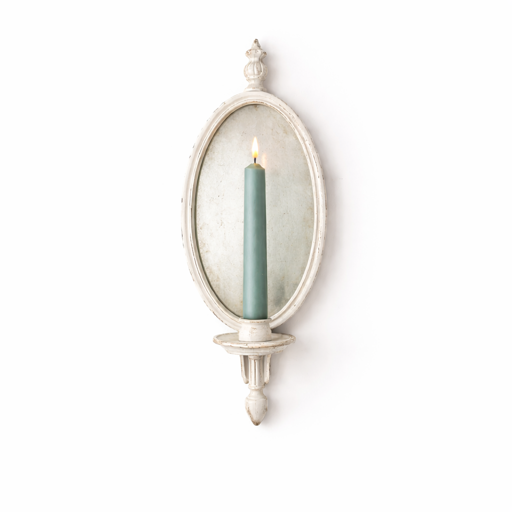 Decorative wall sconce with a candle inside on a white background