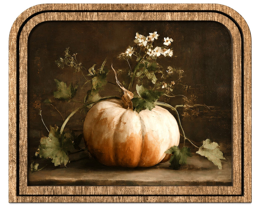A framed still life artwork showing a pale orange pumpkin with white flowers and green leaves against a dark brown background, enclosed in a textured wood-toned frame.