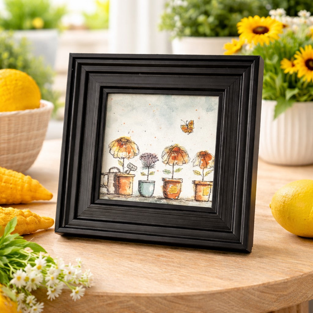Watercolor art print of potted flowers and butterfly in 6x6 black resin frame for tabletop or wall display