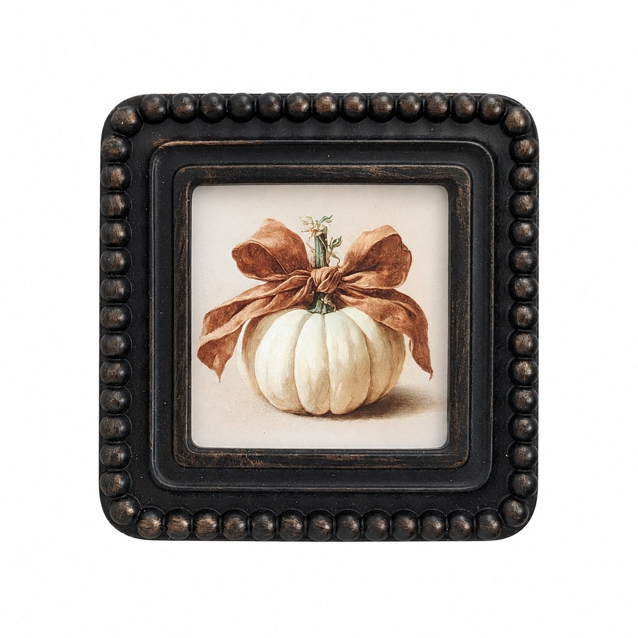 A square decorative framed print featuring a white ribbed pumpkin tied with a brown ribbon, set in a distressed black beaded frame against a white background.