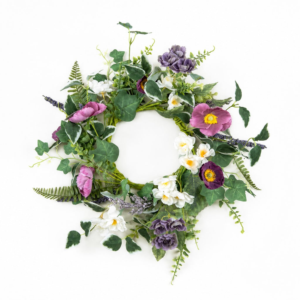 Floral wreath with greenery, purple, white, and pink flowers on a white background
