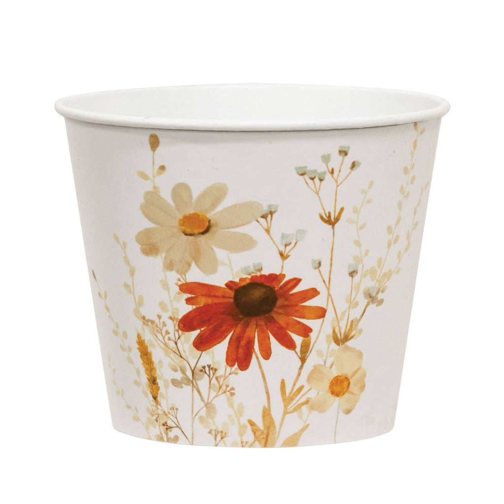 Tin bucket container with floral design on a white background