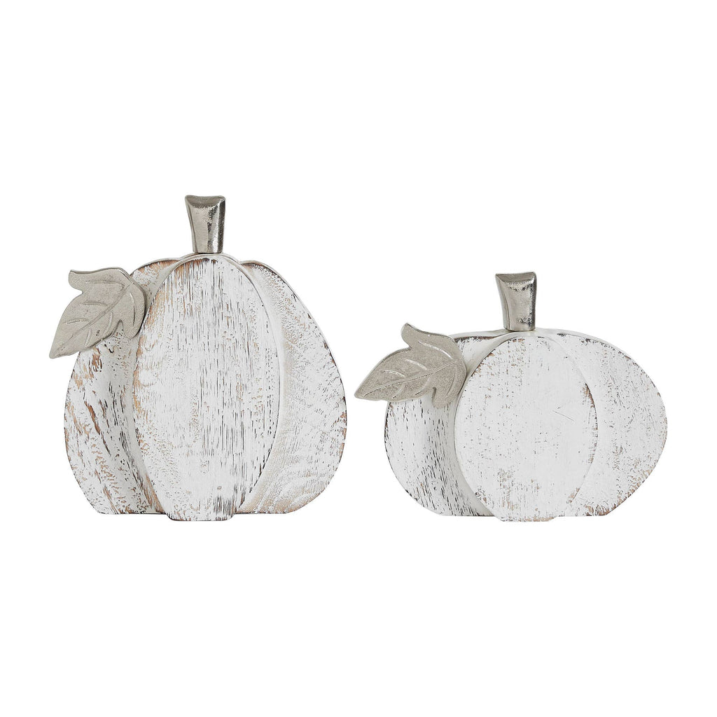 Two white wooden pumpkins with leaf decorations on a white background