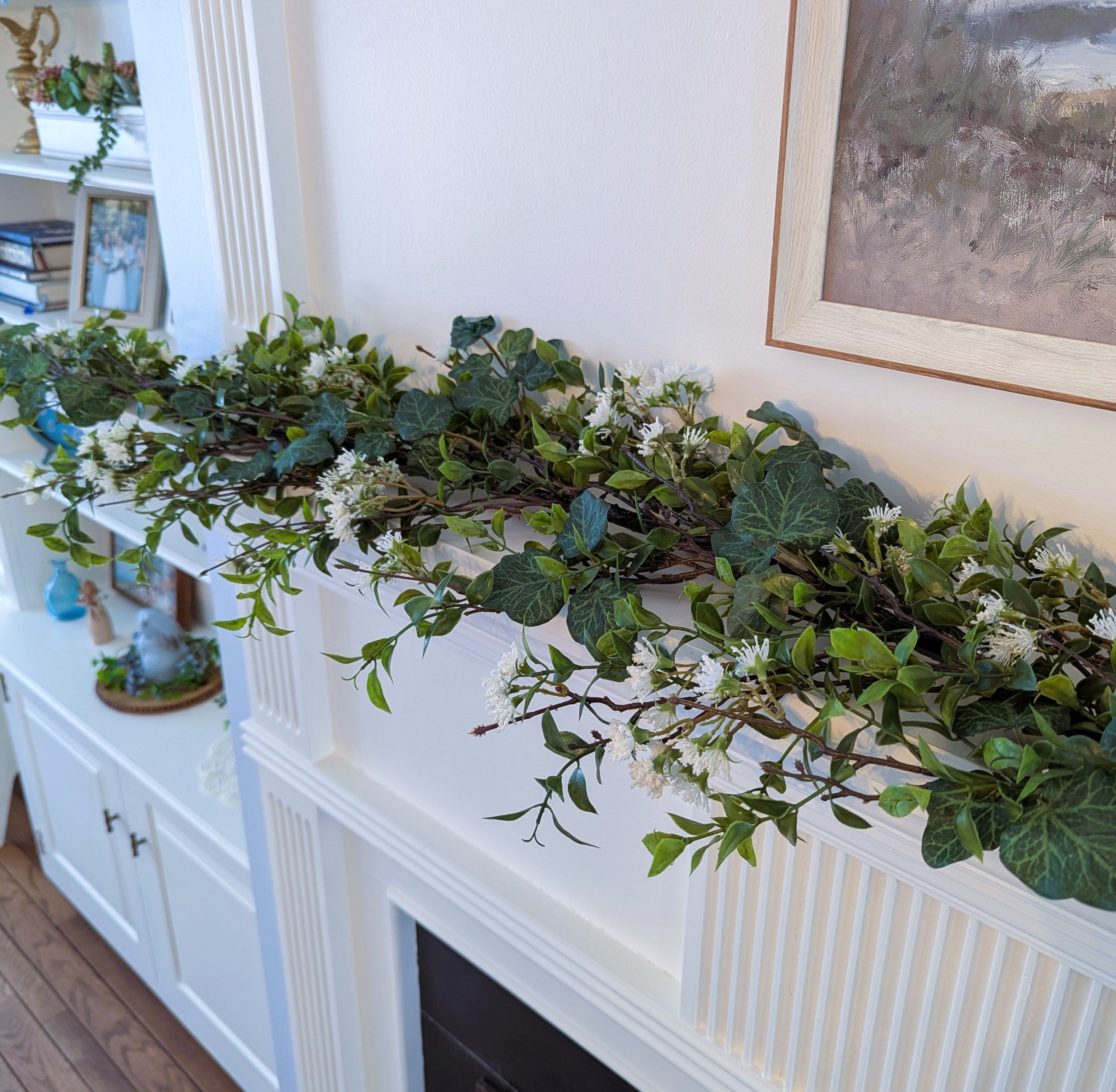 Ivy and Tea Leaf Garland, 60 inch artificial greenery with white flowers for mantel shelf and table decor.