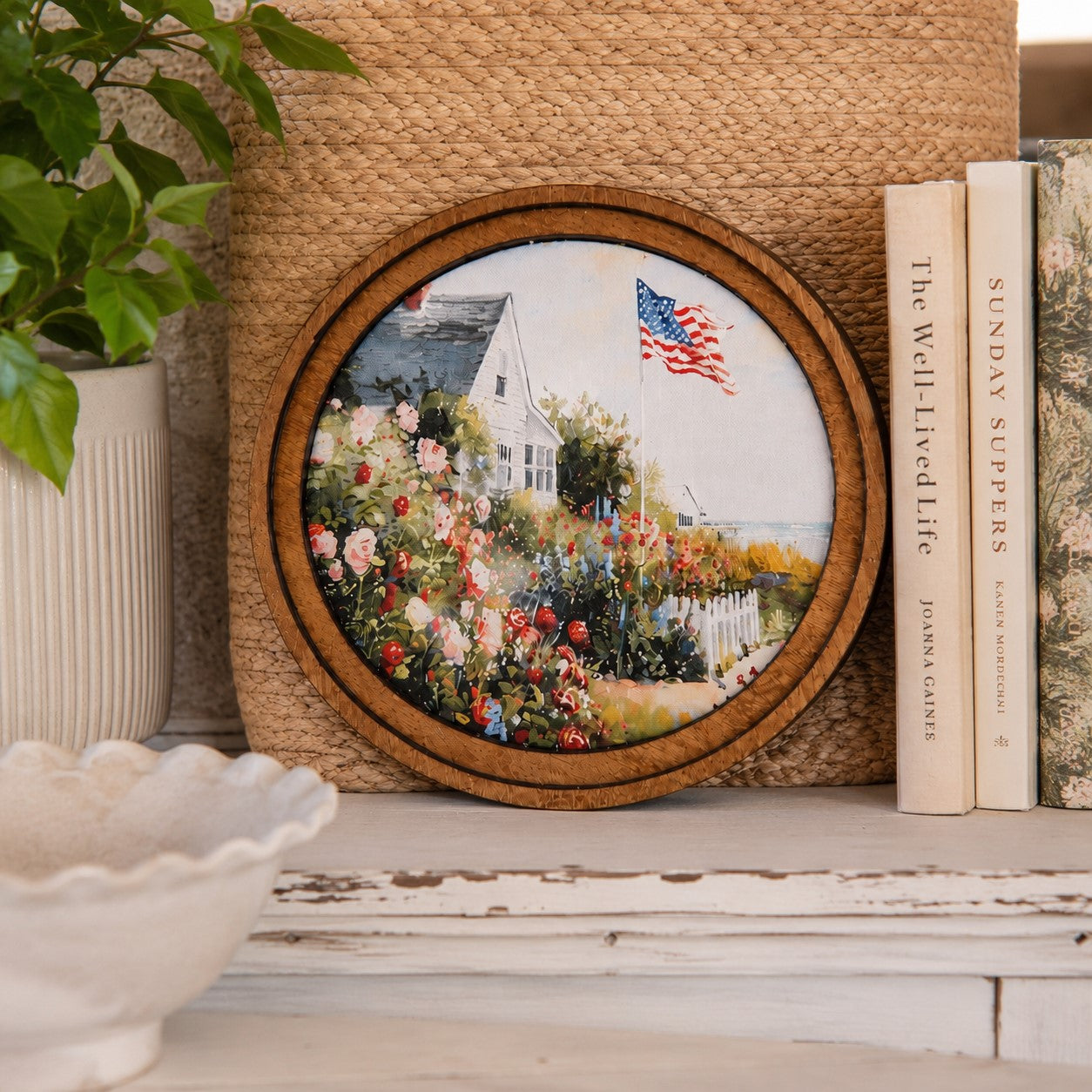 Decorative framed art round with patriotic coastal scene and flag