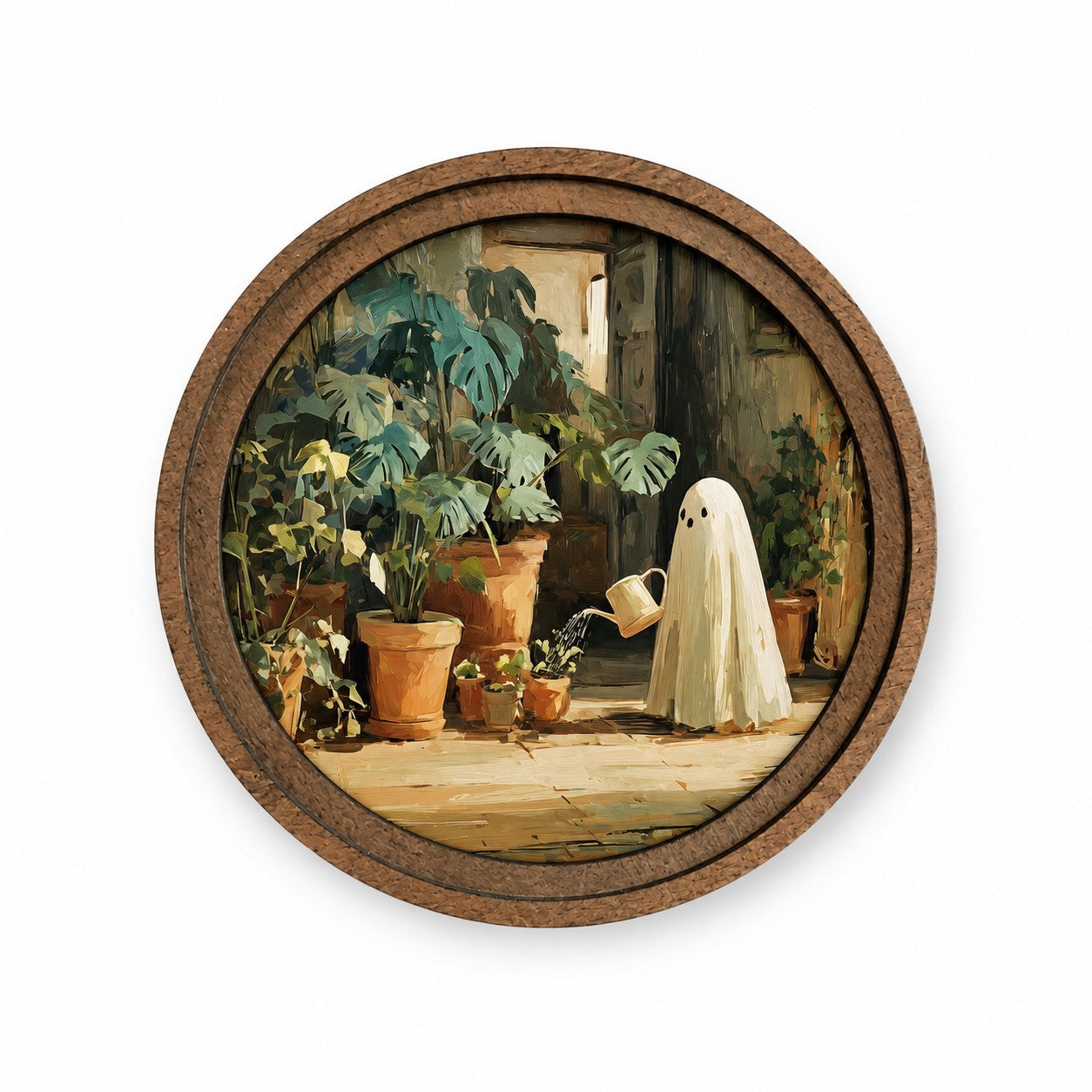Round wooden-framed ghost gardener artwork leaning against a white wall with warm sunlight, featuring a whimsical ghost watering houseplants.