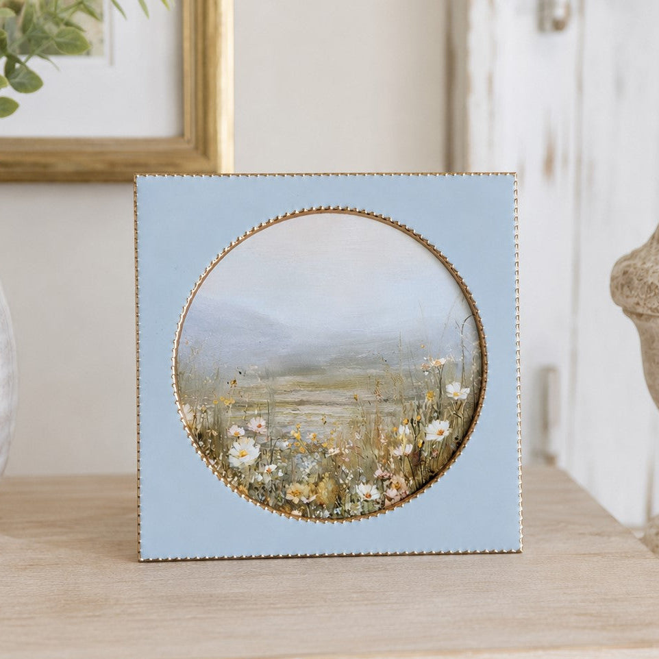 Decorative meadow flowers in blue ceramic and metal frame